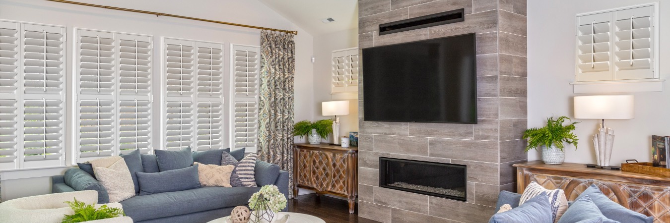 Interior shutters in a Hampton Roads living room with fireplace